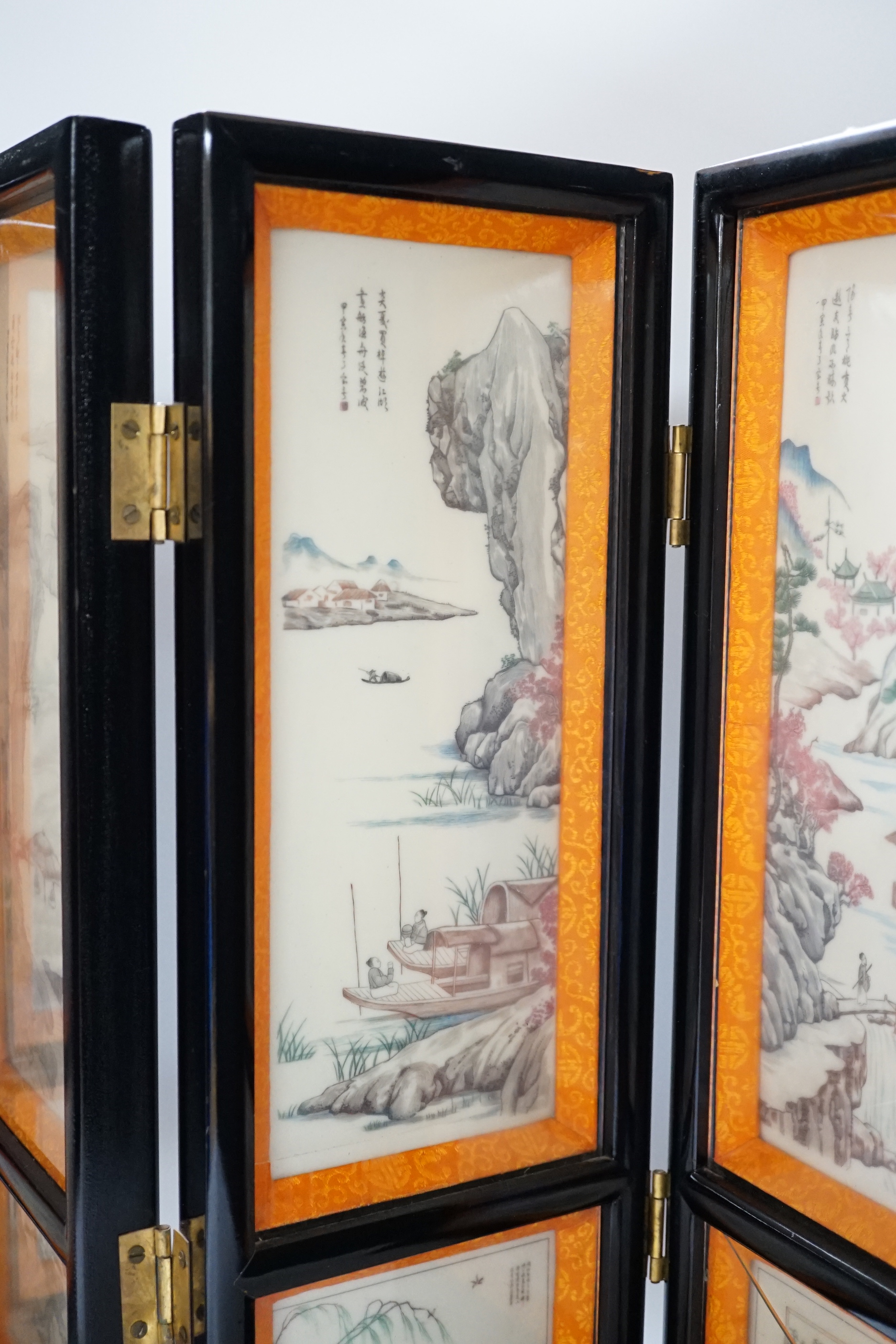 A 20th century Chinese resin three fold screen, 46cm tall
